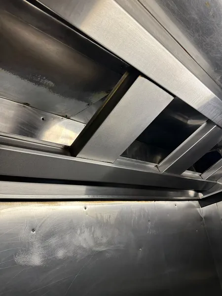 Inside a hood after cleaning, with clean stainless steel